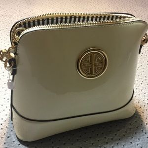 Brand new small patent cream purse